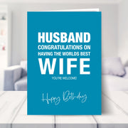 funny husband birthday card shown in a living room
