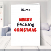 insulting christmas cards shown in a living room