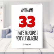 funny 33rd birthday card shown in a living room