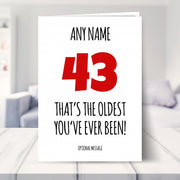 funny 43rd birthday card shown in a living room