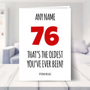 funny 76th birthday card shown in a living room