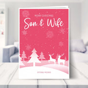 Son & Wife christmas card shown in a living room