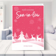Son-in-law christmas card shown in a living room