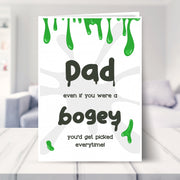 dad birthday card shown in a living room