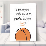 funny birthday cards for her shown in a living room