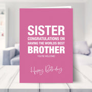 funny sister birthday card shown in a living room