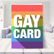 gay birthday cards for men shown in a living room