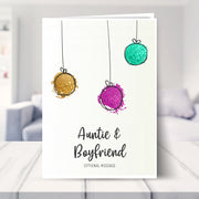 Auntie & Boyfriend christmas card shown in a living room