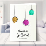 Auntie & Girlfriend christmas card shown in a living room