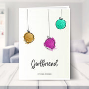 Girlfriend christmas card shown in a living room
