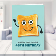 48th birthday card shown in a living room