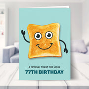 77th birthday card shown in a living room