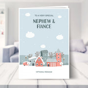 nephew and fiance christmas card shown in a living room