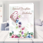 daughter birthday card shown in a living room