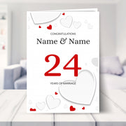 24th wedding anniversary card shown in a living room