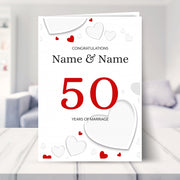 50th wedding anniversary card shown in a living room
