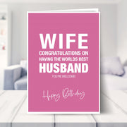funny wife birthday card shown in a living room