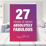 27th birthday card shown in a living room
