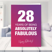 28th birthday card shown in a living room