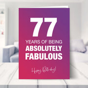 77th birthday card shown in a living room