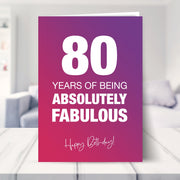 80th birthday card shown in a living room