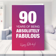90th birthday card shown in a living room
