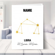 libra birthday card shown in a living room